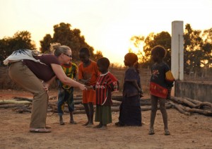 Dana Allison meets some of the local children in a village in Senegal