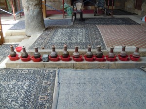 Water is precious in Egypt.  These water jugs are placed in the mosque so that people can drink.