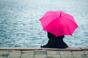 Woman with pink umbrella