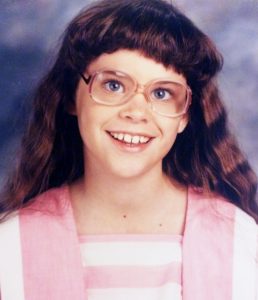 April Young Bennett age 12 with glasses