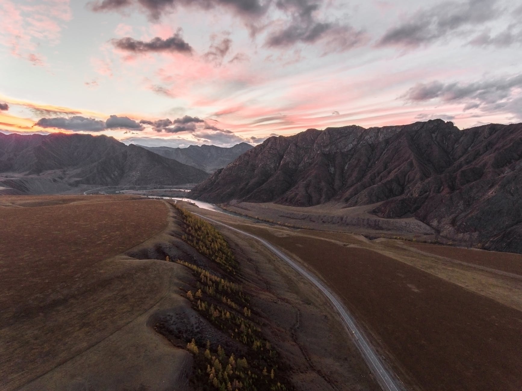 road among textural mountains and valley