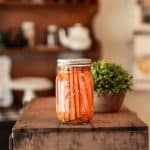 Bottled carrots on a wooden table