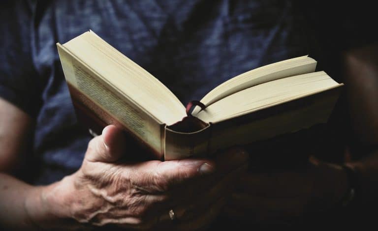 hand holding an open book