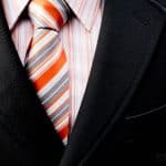 A man's dress shirt, jacket and tie