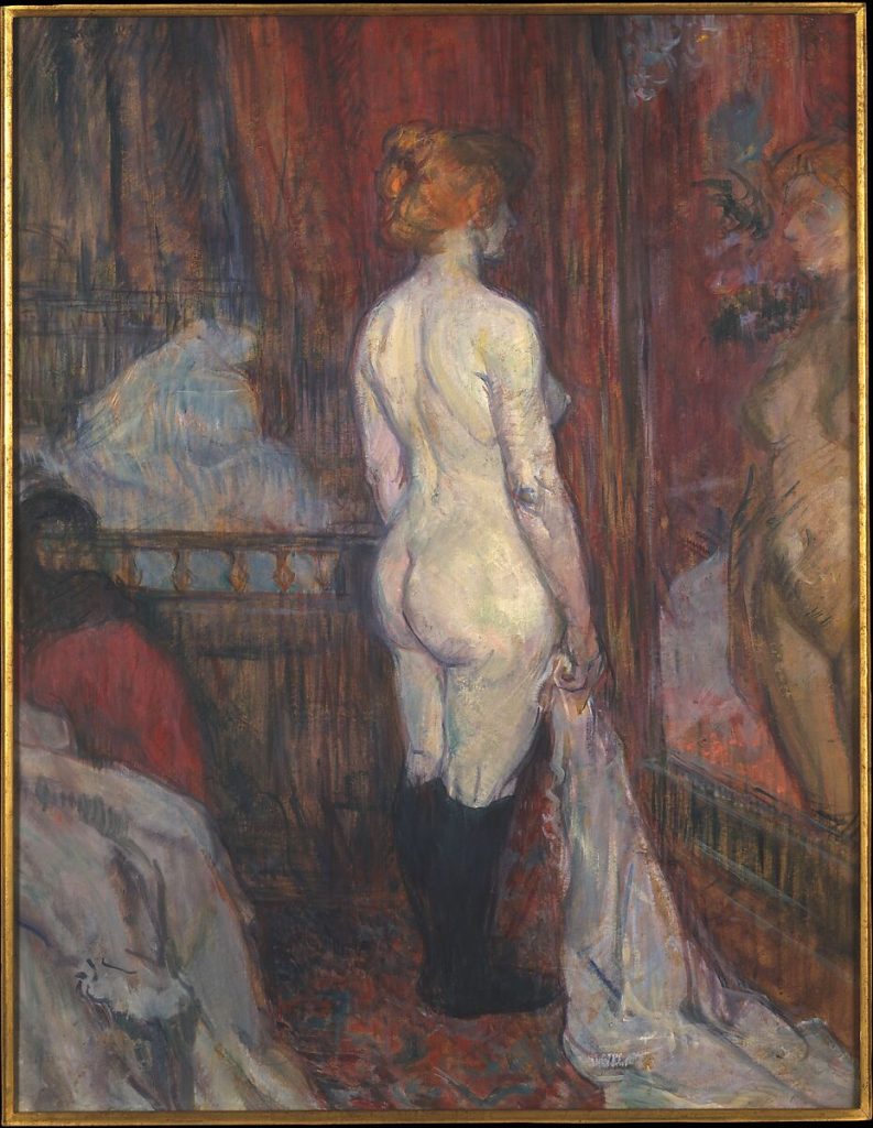 Nude white woman stands in front of mirror