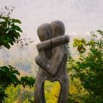 sculpture of two people hugging