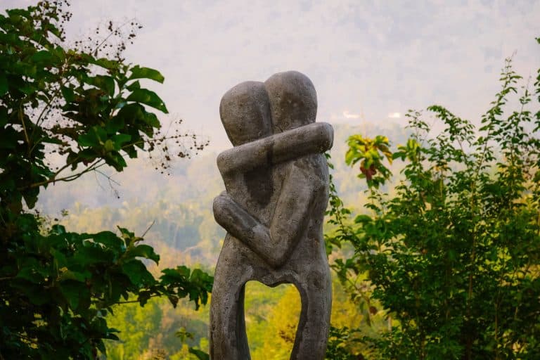 sculpture of two people hugging