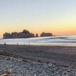 Sunset on the rocky shore of Rialto Beach, Washington.