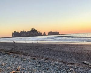 Sunset on the rocky shore of Rialto Beach, Washington.