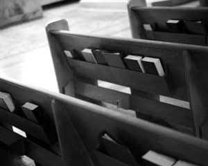 church pews with hymn books